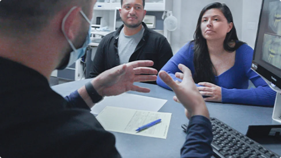 A dentist performing a thorough dental evaluation on a patient.