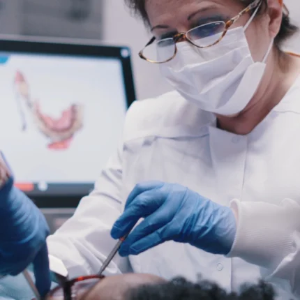 Dr. Irma Gavaldón performing an emergency dental treatment using advanced technology