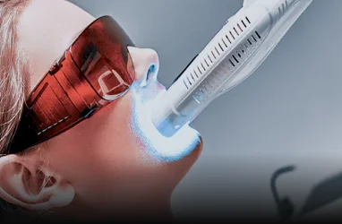 Application of whitening gel or treatment during the procedure.